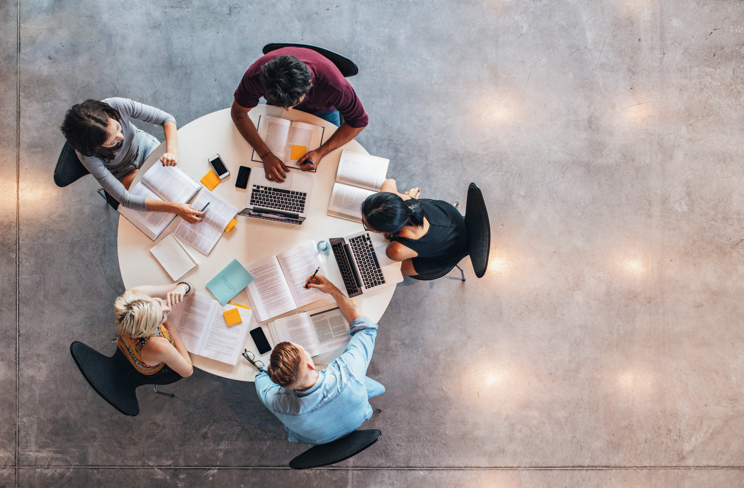 Group of scholarship reviewers working together at a table