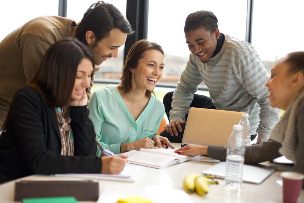 Multiracial young people enjoying group study