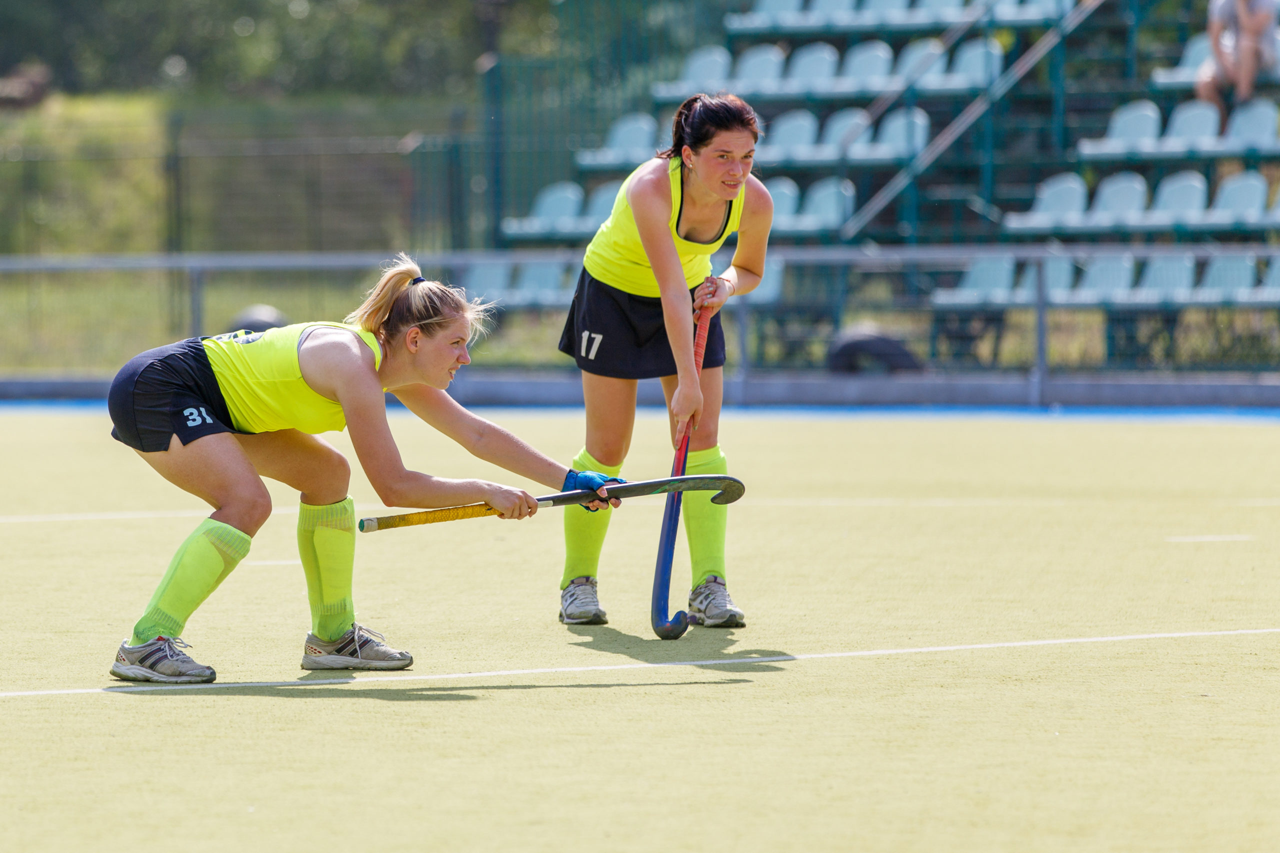 Two young field hockey player girls